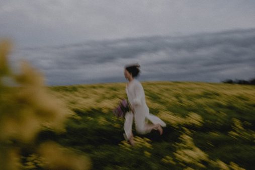 a person running on the flower field