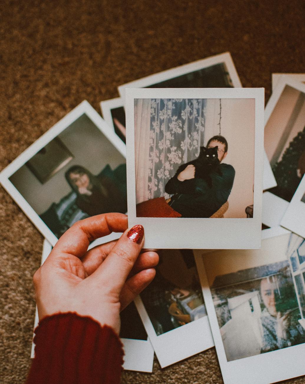 photo of person holding polaroid
