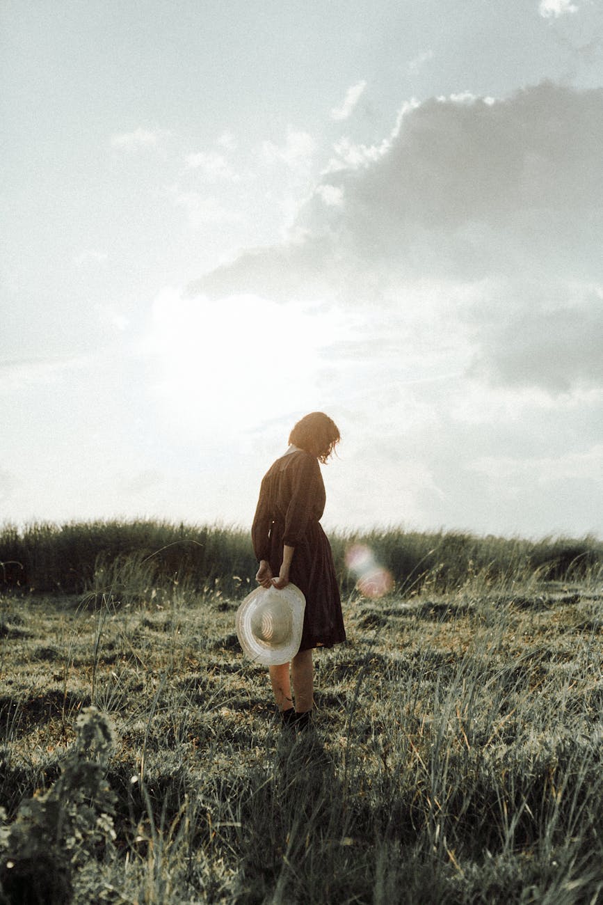 woman standing on green grass